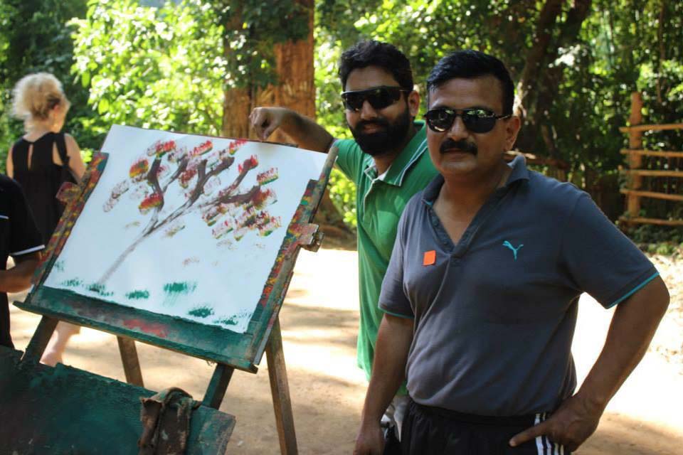 Phithvi and Bhanu appreciating the painting done by an elephant